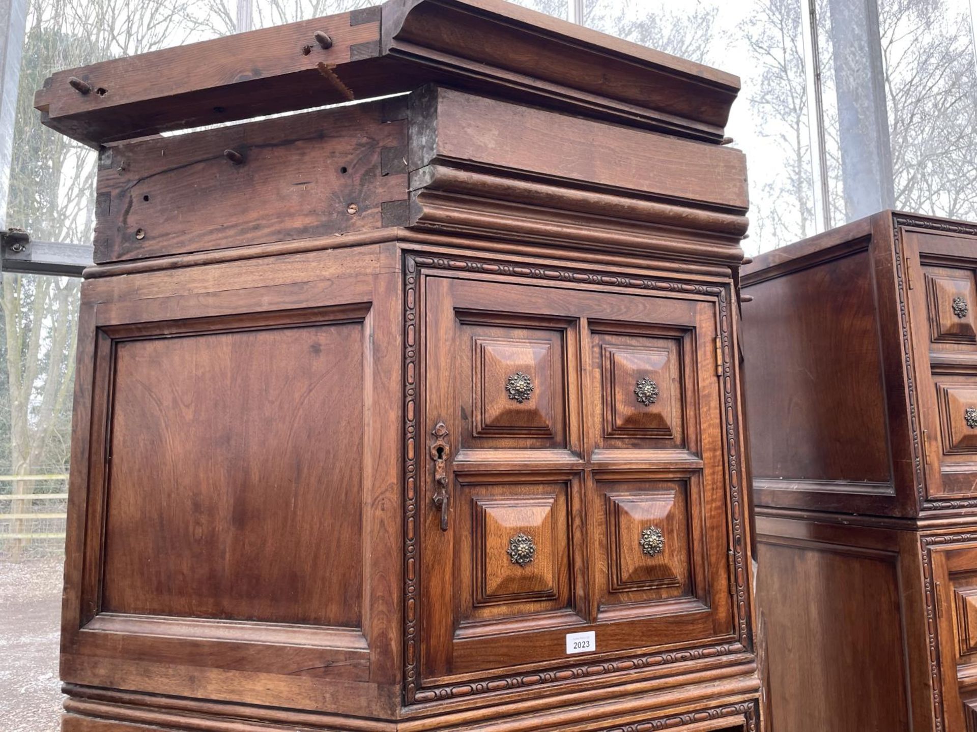 A SPANISH WALNUT HEAVILY PANELED CORNER CABINET WITH UPPER DOOR AND THREE DRAWERS WITH APPLIED BRASS - Image 2 of 3