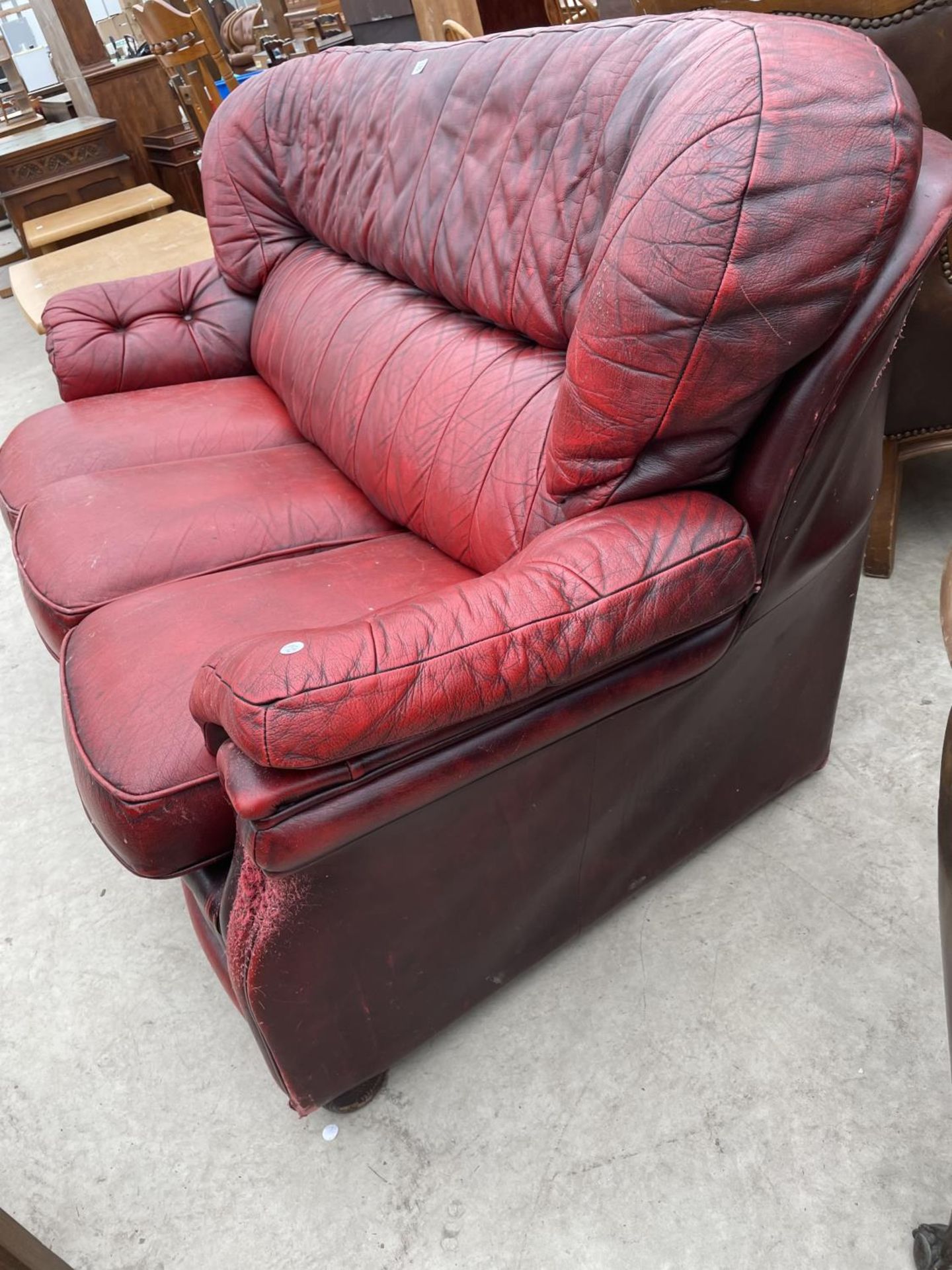 AN OXBLOOD THREE SEATER SETTEE - Image 7 of 7