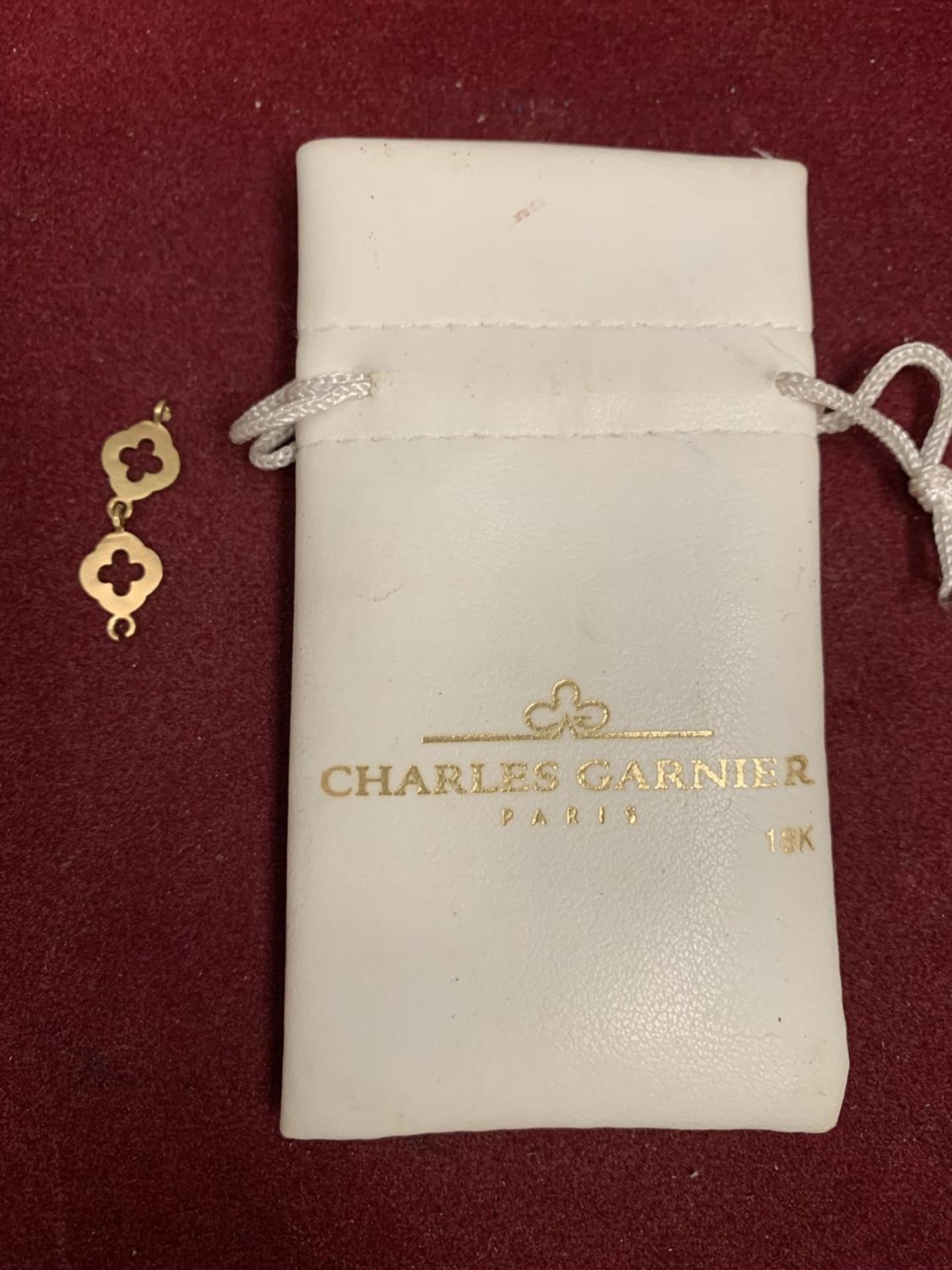 A CHARLES GARNIER 18K YELLOW GOLD SPARE BRACELET LINKS IN BAG GROSS WEIGHT 1.7 GRAMS