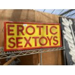 AN ILLUMINATED 'EROTIC SEXTOYS' SIGN