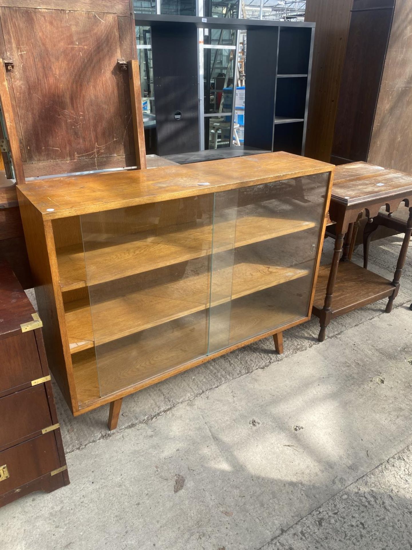 A LIGHT OAK BOOKCASE