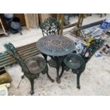 A VINTAGE HEAVY CAST IRON BISTRO SET WITH THREE CHAIRS AND A TABLE