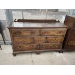 A GEORGE III OAK AND CROSSBANDED LANCASHIRE CHEST WITH FIVE DRAWERS AND TWO SHAM DRAWERS W: 64