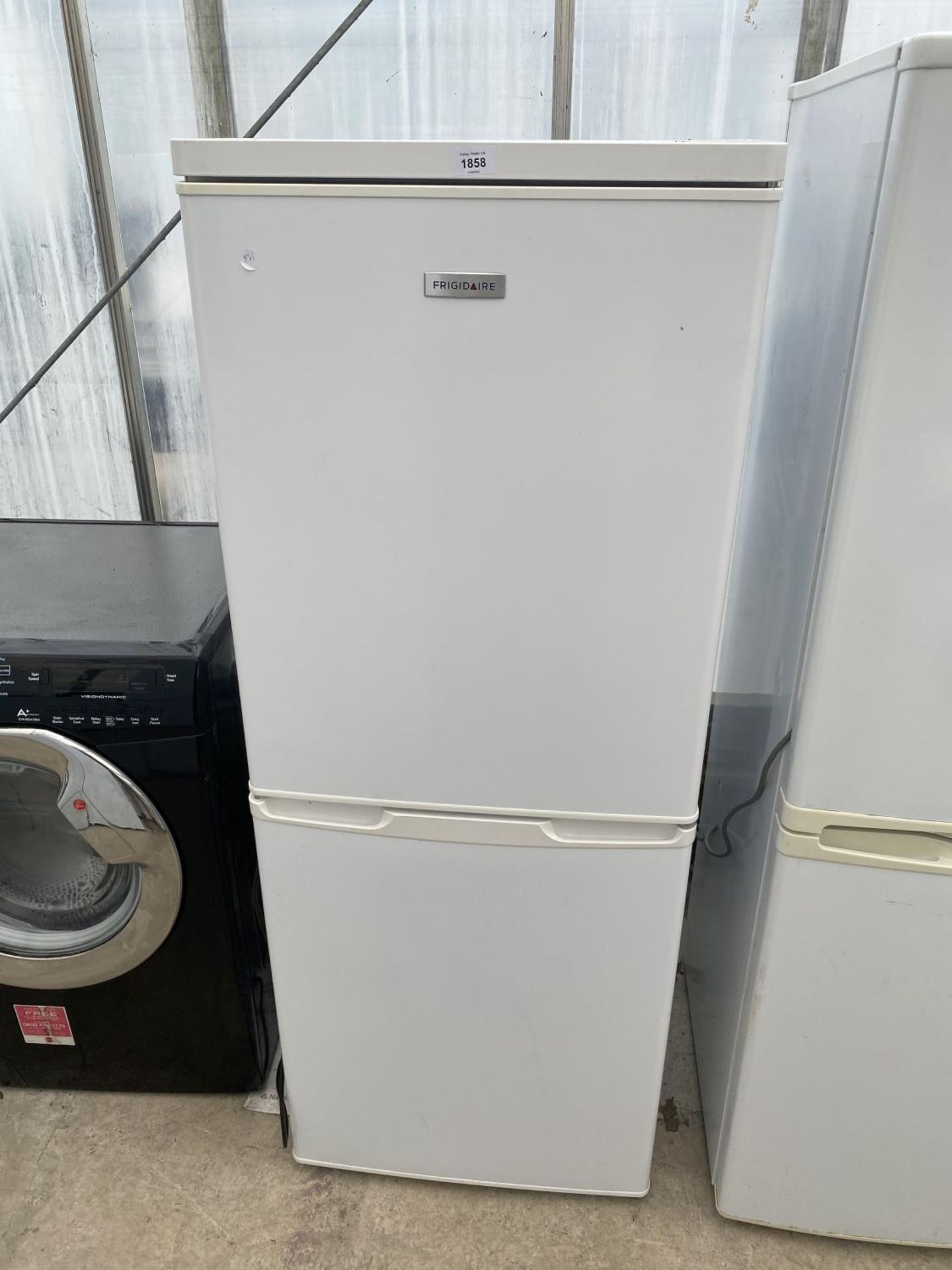 A WHITE FRIGIDAIRE UPRIGHT FRIDGE FREEZER BELIEVED IN WORKING ORDER BUT NO WARRANTY