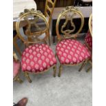 A PAIR OF 19TH CENTURY STYLE GILT BEDROOM CHAIRS WITH LYRE BACK