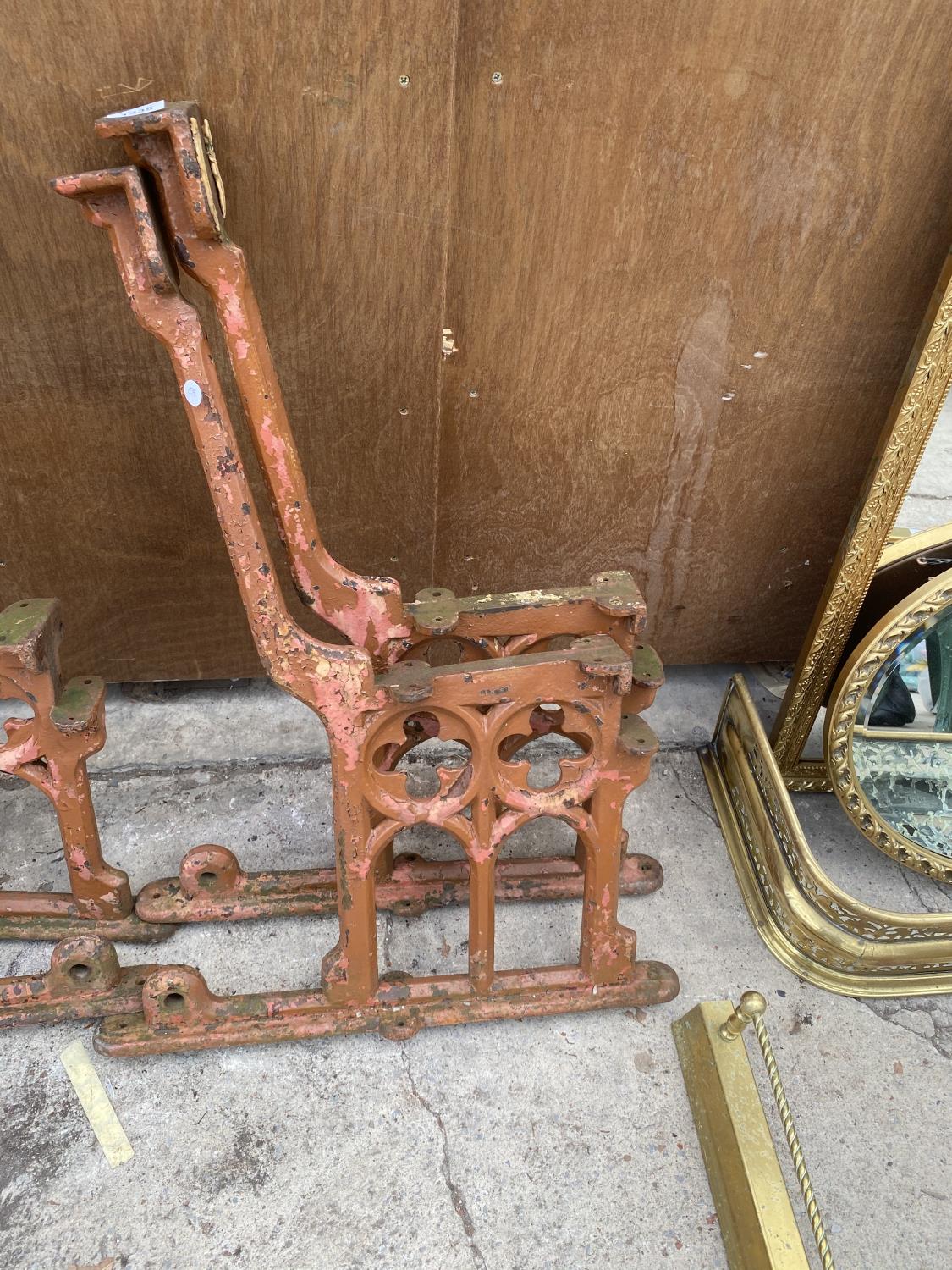 A PAIR OF VINTAGE DECORATIVE CAST IRON BENCH ENDS