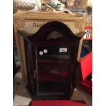 A SMALL GLAZED WALL HANGING DISPLAY CABINET WITH BOX