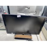 A 22" LOGIK TELEVISION WITH REMOTE CONTROL BELIEVED IN WORKING ORDER BUT NO WARRANTY