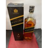 A 1 LITRE BOTTLE OF JOHNNIE WALKER BLACK LABEL