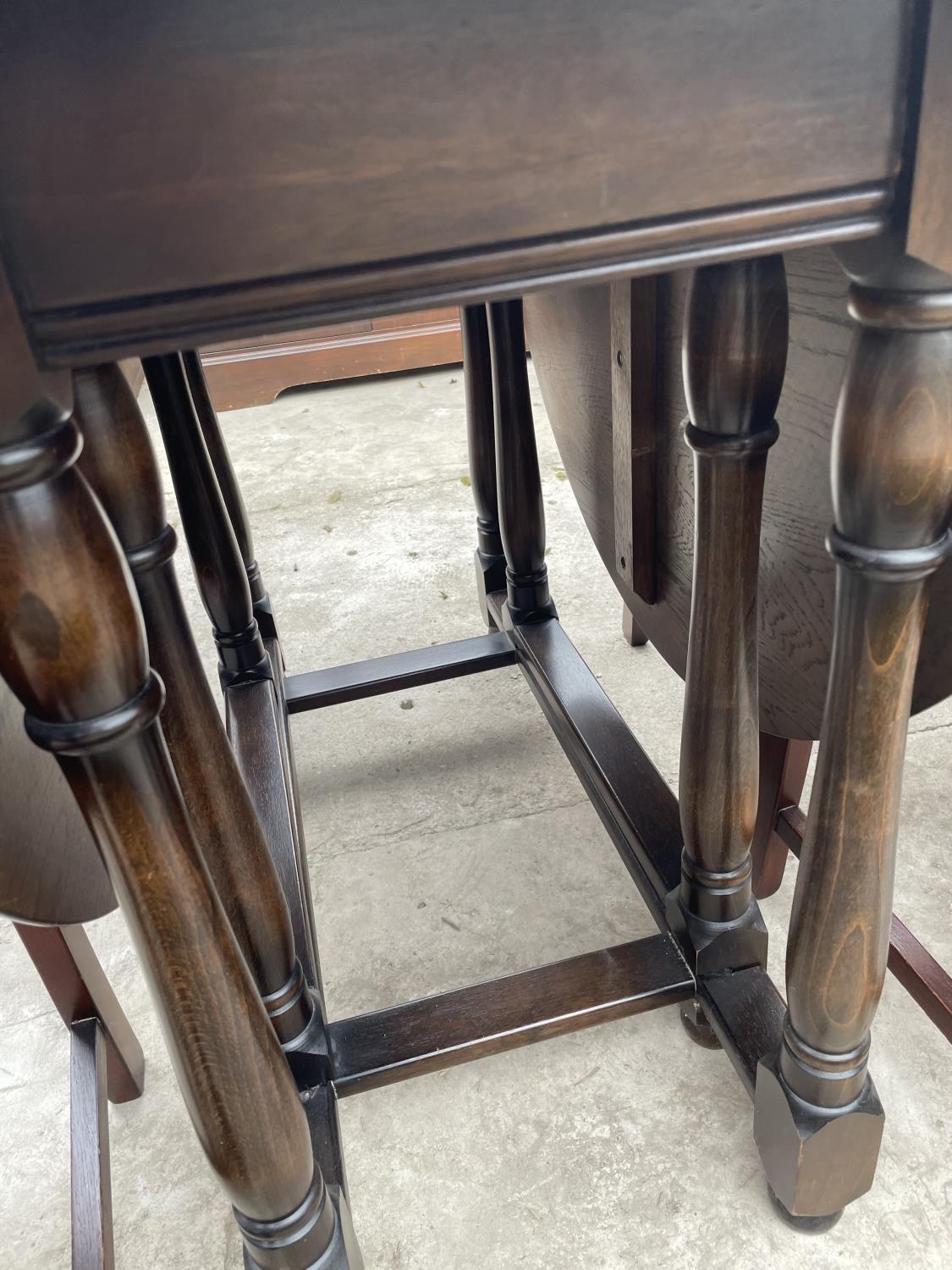 A REPRODUCTION GATE-LEG TABLE AND FOUR CHAIRS - Image 5 of 5