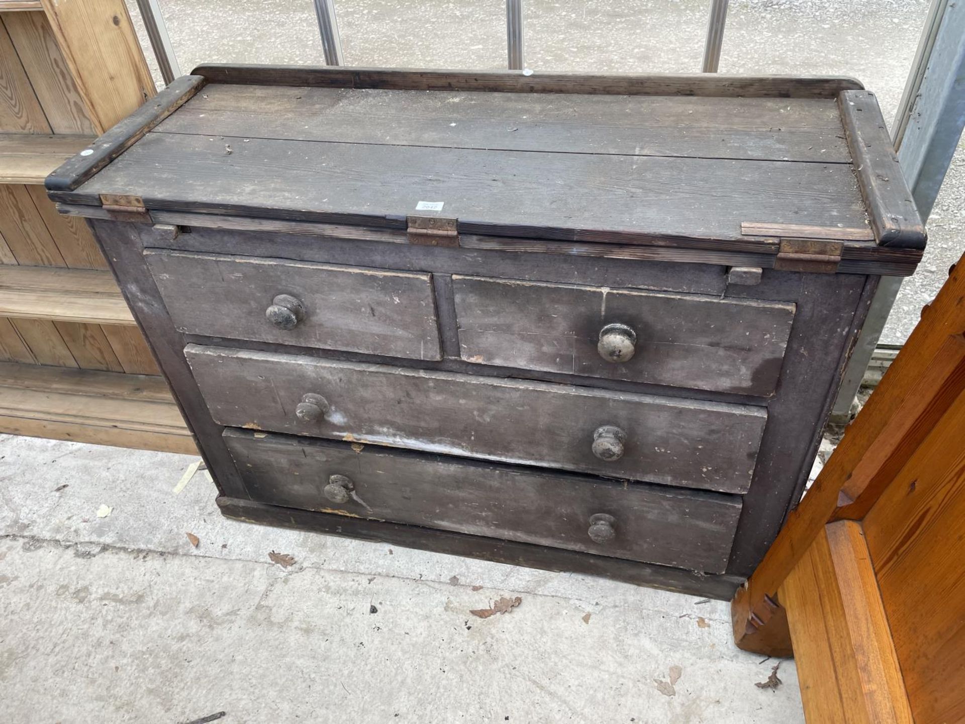 A VICTORIAN PINE CHEST OF TWO SHORT AND TWO LONG DRAWERS WITH FOLD-OVER WORK TOP