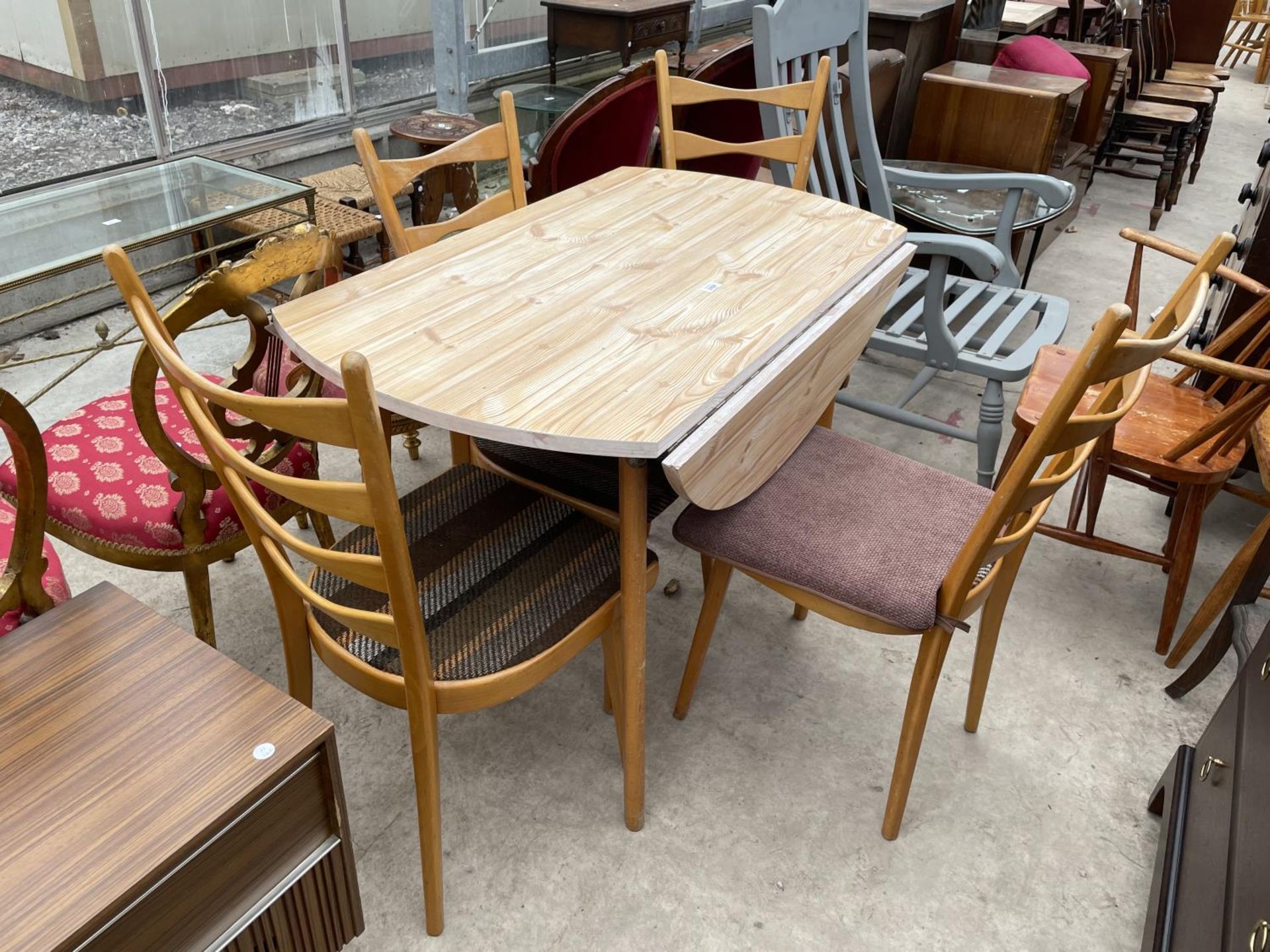 FOUR SARDAN LADDER BACK KITCHEN CHAIRS UPHOLSTERED IN MERKALON AND A DROP LEAF TABLE