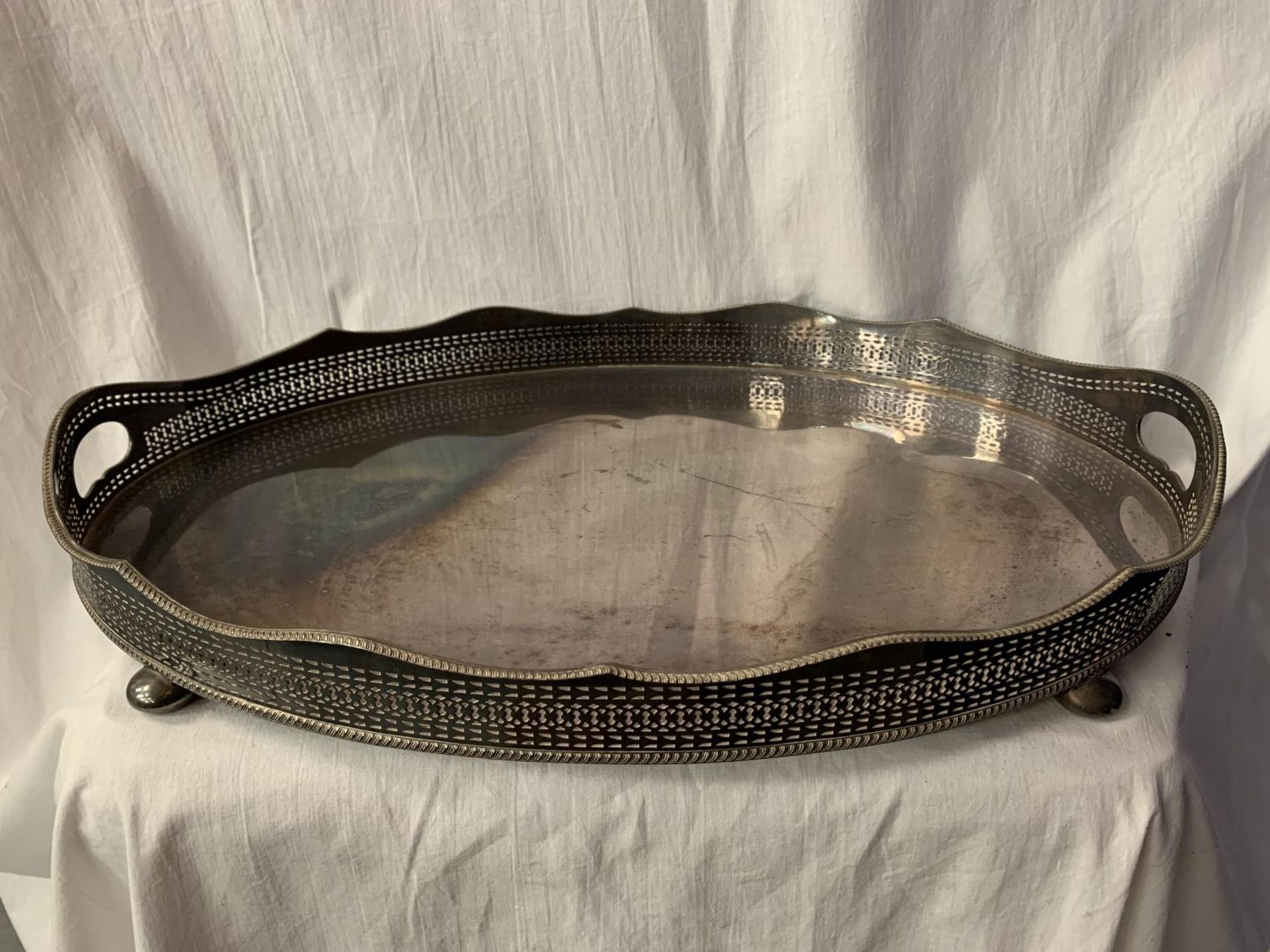 A LARGE SILVER PLATED TWIN HANDLED BUTLER'S TRAY L: 56CM