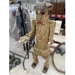 A LARGE MALE FIGURE CONSTRUCTED FROM WINE BOTTLE CORKS BELIEVED TO BE IN THE FORM OF DONALD TRUMP
