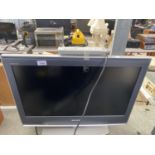 A 26" SONY BRAVIA TELEVISION WITH REMOTE BELIEVED IN WORKING ORDER BUT NO WARRANTY