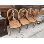 A SET OF FOUR MODERN WHEEL BACK WINDSOR STYLE CHAIRS