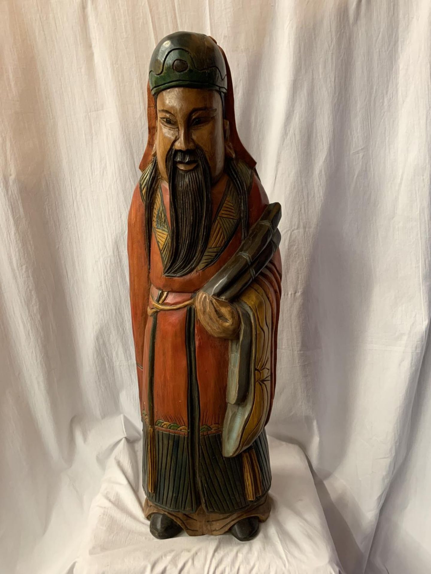 A LARGE CARVED AND HANDPAINTED FIGURE OF A JAPANESE CLERIC (H:90CM)