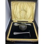 A VINTAGE BOXED EPNS SET COMPRISING OF A SPOON AND PUSHER AND A NAPKIN RING