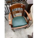 A HARDWOOD OFFICE STYLE ELBOW CHAIR ON POLISHED METAL FEET