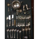 A LARGE QAUNTITY OF SILVER PLATED ITEMS TO INCLUDE A PAIR OF RIDING BOOTS, TWIN HANDLED DISH SPPONS,