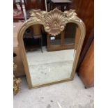 A MODERN GILT FRAMED WALL MIRROR