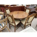 A REPRODUCTION OAK CIRCULAR EXTENDING DINING TABLE, 48" DIAMETER AND FOUR MATCHING CHAIRS