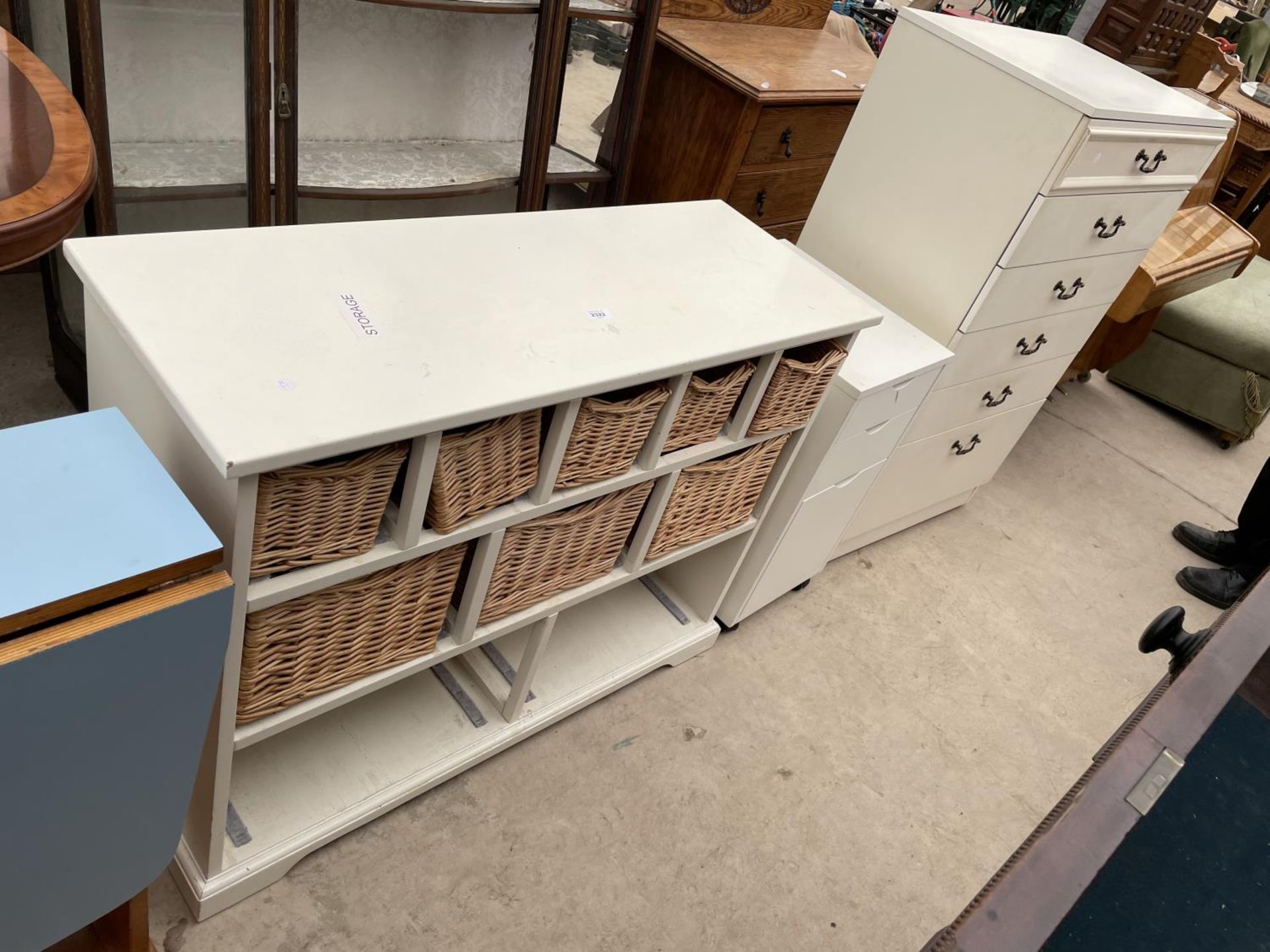 A WHITE STORAGE CHEST WITH EIGHT BASKETS, SIX DRAWER CHEST AND SMALL THREE DRAWER CHEST