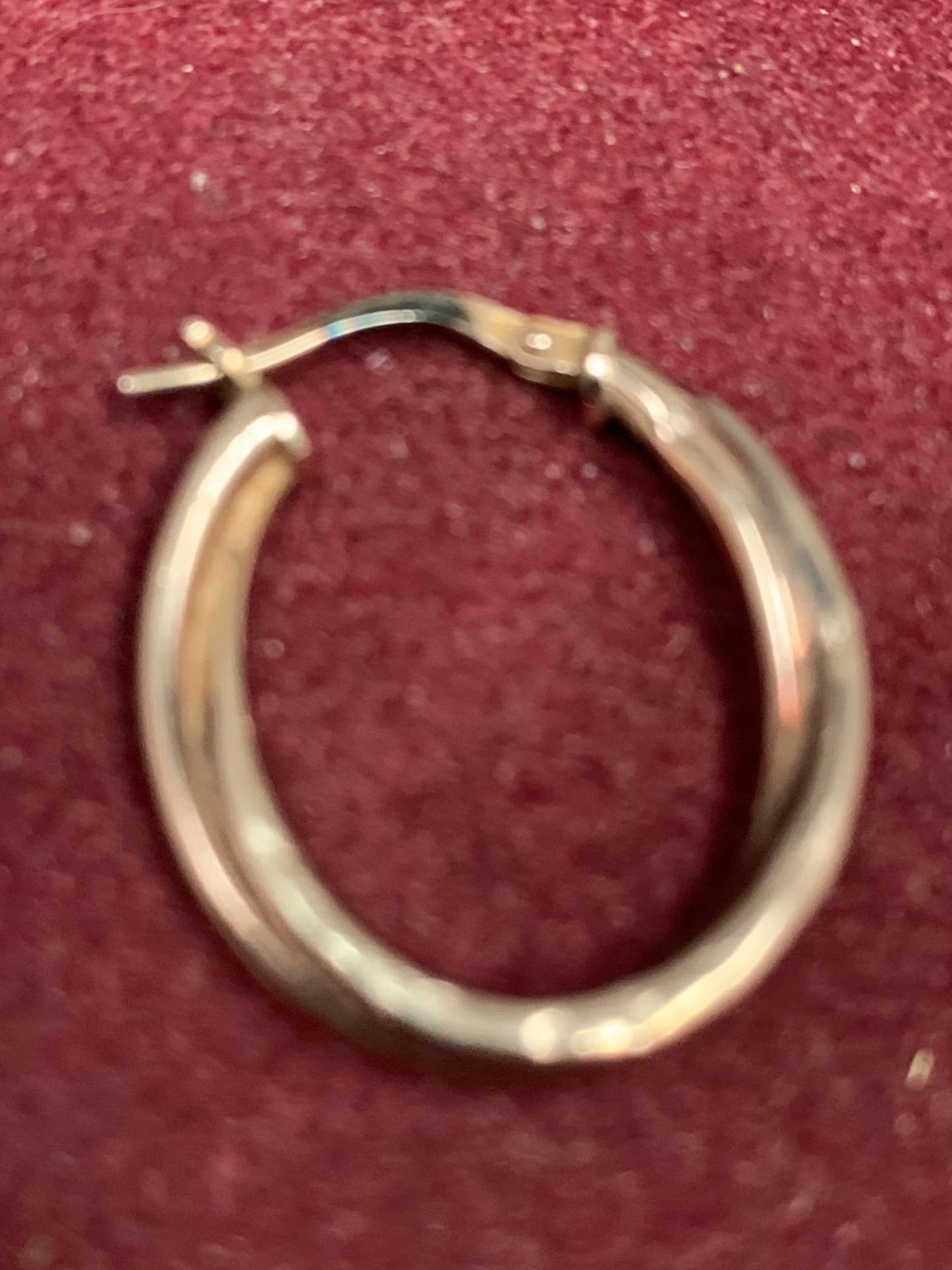 A 9CT YELLOW GOLD HOOP EARRING GROSS WEIGHT 0.9 GRAMS - Image 2 of 2