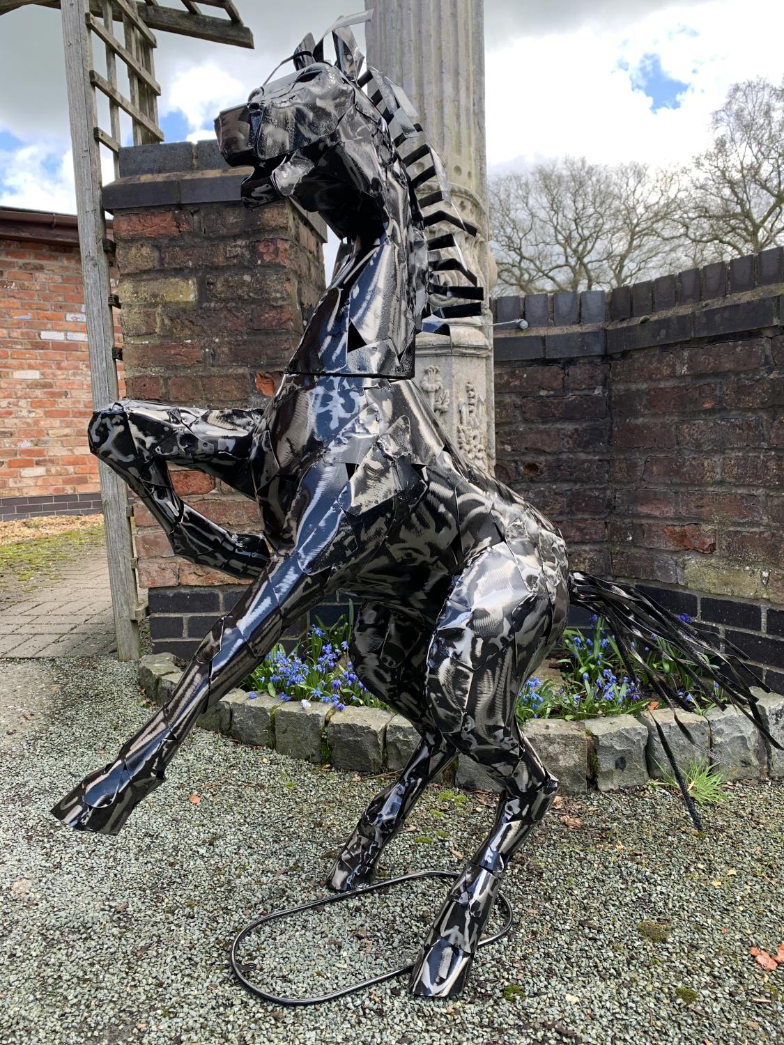 A LARGE METAL SCULPTURE IN THE FORM OF A REARING HORSE H: 125CM