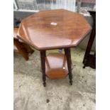 AN EDWARDIAN OCTAGONAL MAHOGANY TWO TIER OCCASIONAL TABLE ON TURNED LEGS