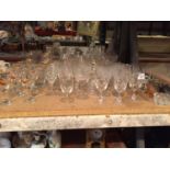 A LARGE COLLECTION OF GLASS WARE TO INCLUDE MAINLY DRINKING GLASSES