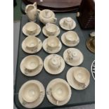 AN ART DECO TEA SET COMPRISING OF CUPS, SAUCERS, MILK JUG AND SUGAR BOWL