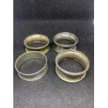FOUR HALLMARKED SILVER NAPKIN RINGS (ONE CHESTER, TWO BIRMINGHAM AND ONE INDISTINCT)