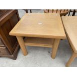 A LIGHT OAK TWO TIER OCCASIONAL TABLE BY SKOVBY, 23.5" SQUARE