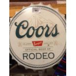 A METAL WALL HANGING 'COORS' BOTTLE CAP SIGN