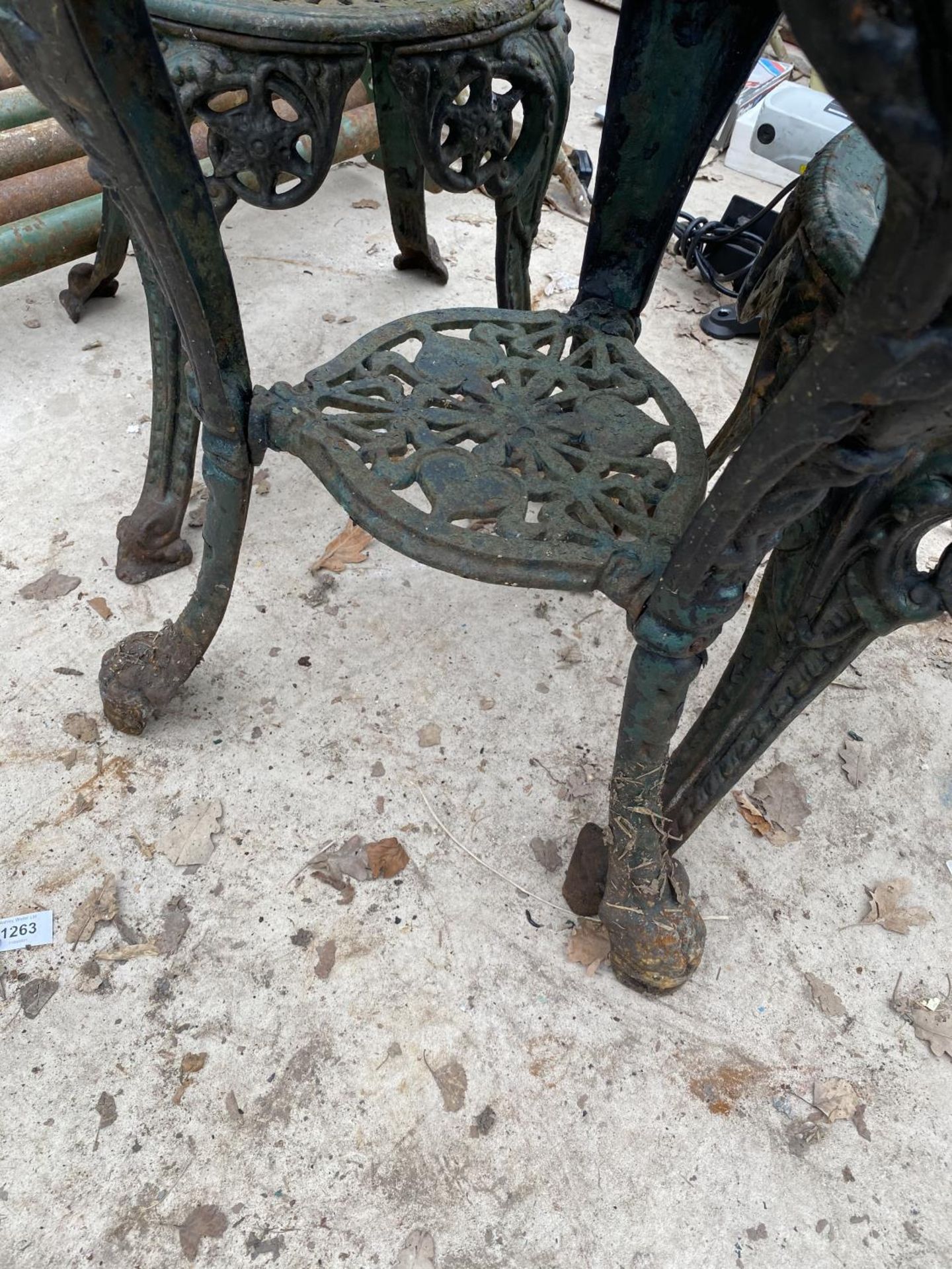 A VINTAGE HEAVY CAST IRON BISTRO SET WITH THREE CHAIRS AND A TABLE - Image 6 of 6