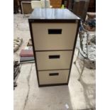A THREE DRAWER STAPLES FILING CABINET
