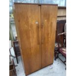 A RETRO TEAK TWO DOOR BEAUTILITY WARDROBE W: 36 INCHES