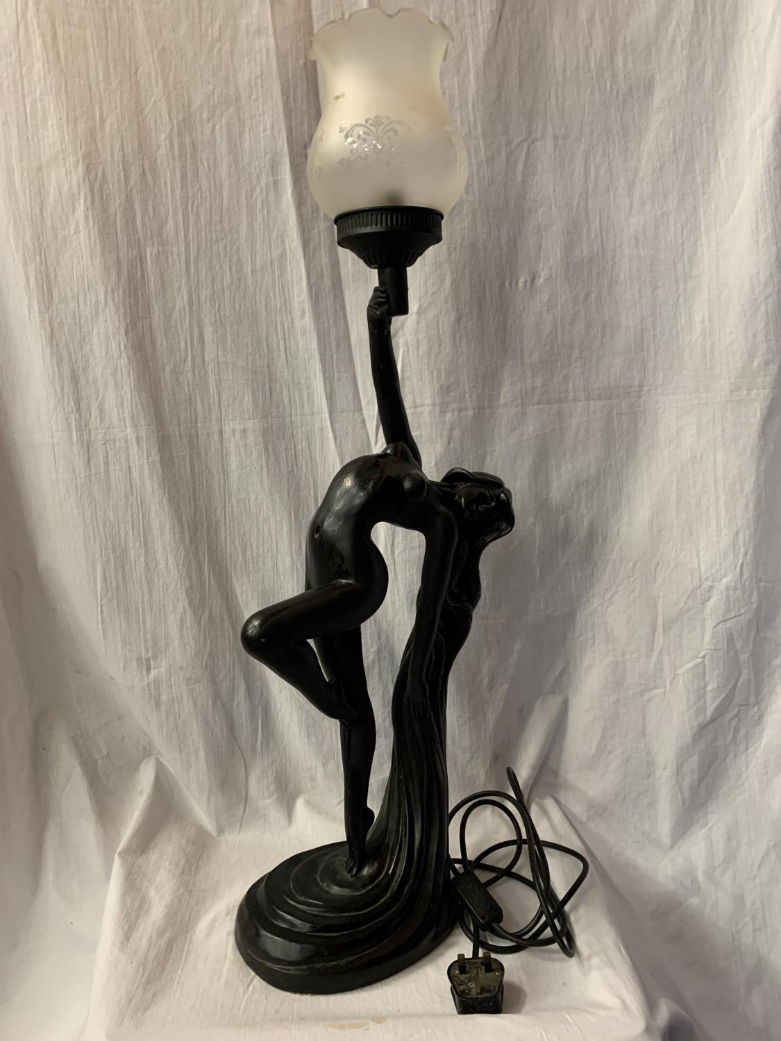 A SPELTER TABLE LAMP IN THE FORM OF A NUDE H:WITH GLASS SHADE 79CM (REPAIR TO HAND)