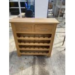 A MDOERN OAK TWENTY-EIGHT BOTTLE WINE RACK WITH TWO DRAWERS BY 'THE COTSWOLD COMPANY', 35.5" WIDE