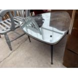 A 1950s TRIANGULAR MIRROR TOP OCCASIONAL TABLE WITH ROUND CORNERS ON BLACK TAPER LEGS