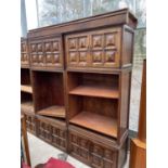 A PAIR OF SPANISH WALNUT HEAVILY PANELED WALL UNITS WITH TWO CUPBOARDS AND THREE DRAWERS TO THE BASE