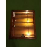 AN OAK FRAMED MIRROR