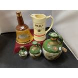THREE SEALED RUTHERFORDS DELUXE SCOTCH WHISKEY JUGS, A BELLS WATER JUG AND AN EMPTY BELLS WHISKEY