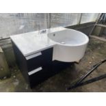 A CURVED SINK UNIT