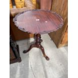 A CHIPPENDALE STYLE TRIPOD TABLE ON BALL AND CLAW FEET DIAMETER: 24 INCHES