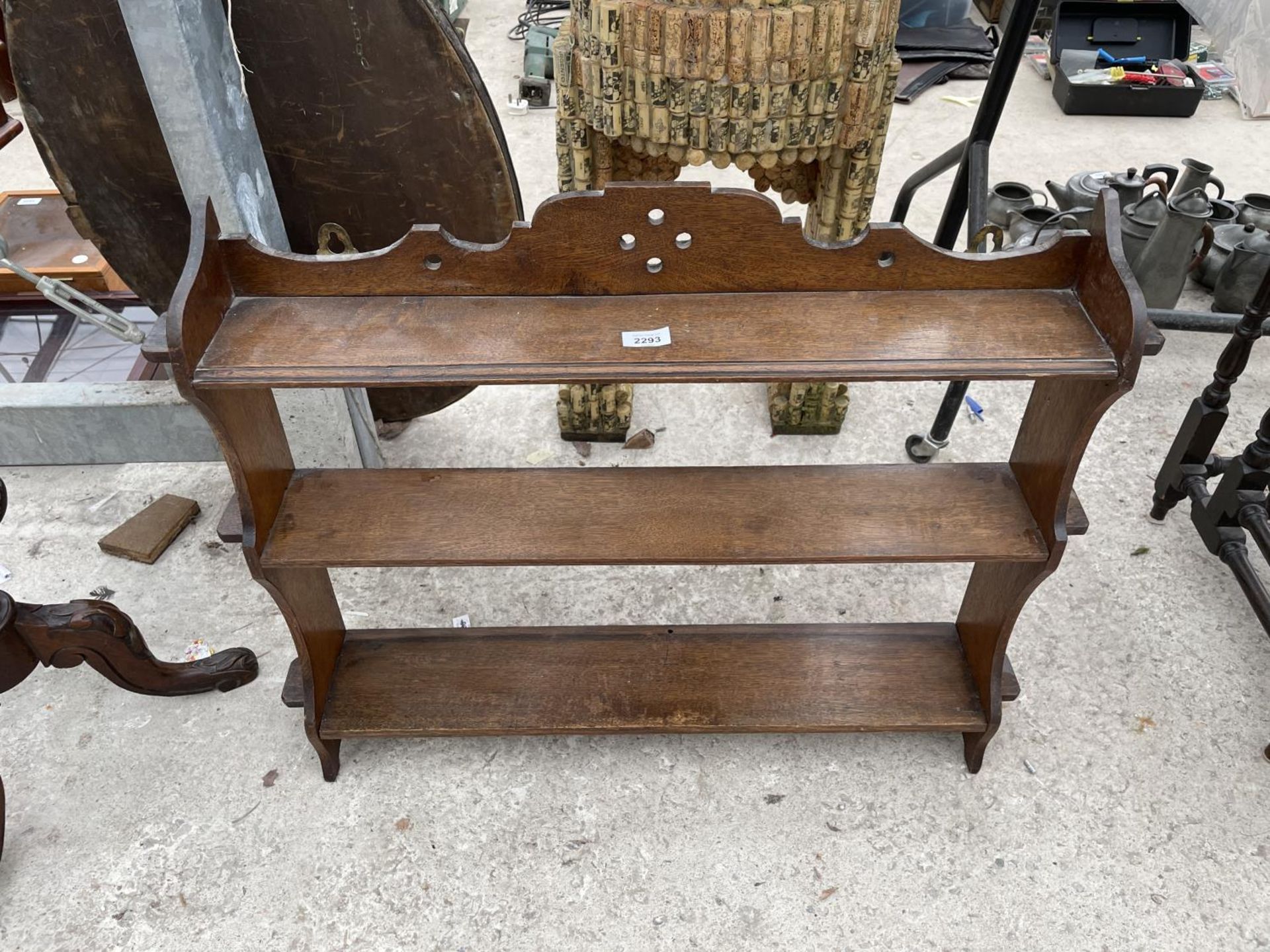 A VICTORIAN OAK THREE TIER WALL SHELF, 32" WIDE