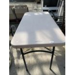 A FOLDING PLASTIC TRESTLE TABLE WITH METAL LEGS
