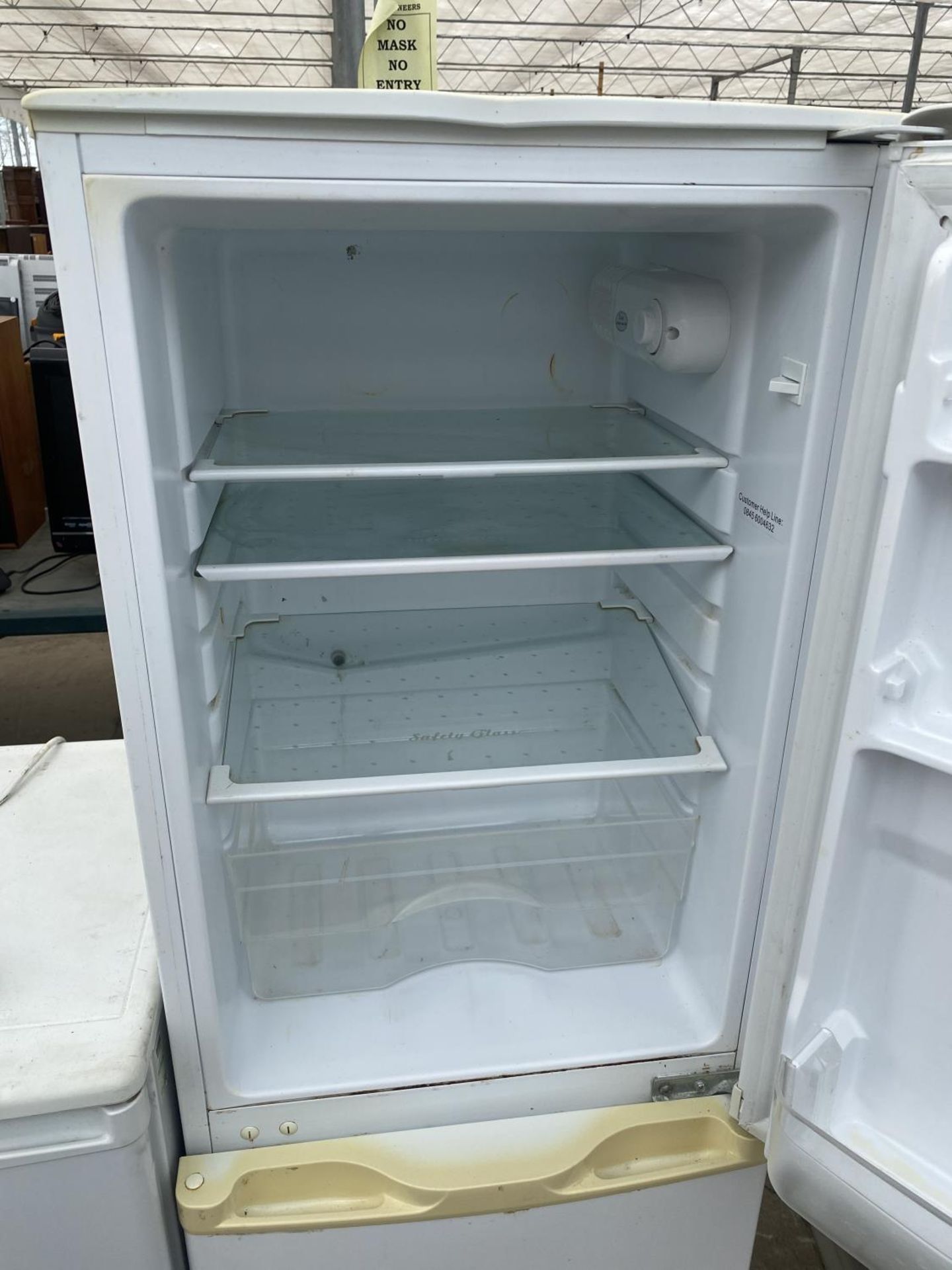 A WHITE UPRIGHT FRIDGE FREEZER BELIEVED IN WORKING ORDER BUT NO WARRANTY - Image 2 of 4