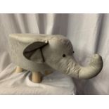 A FAUX LEATHER CHILD'S FOOT STOOL IN THE FORM OF AN ELEPHANT